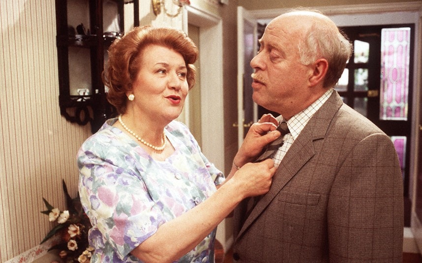 Hyacinth fixing her husband's tie