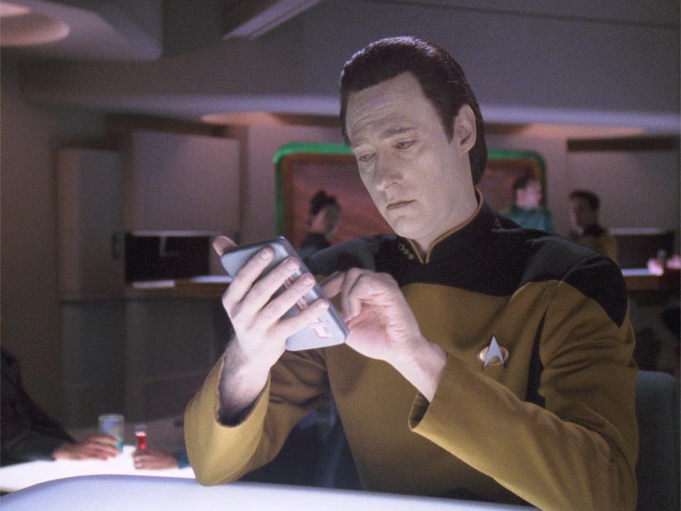 Commander Data with a PADD